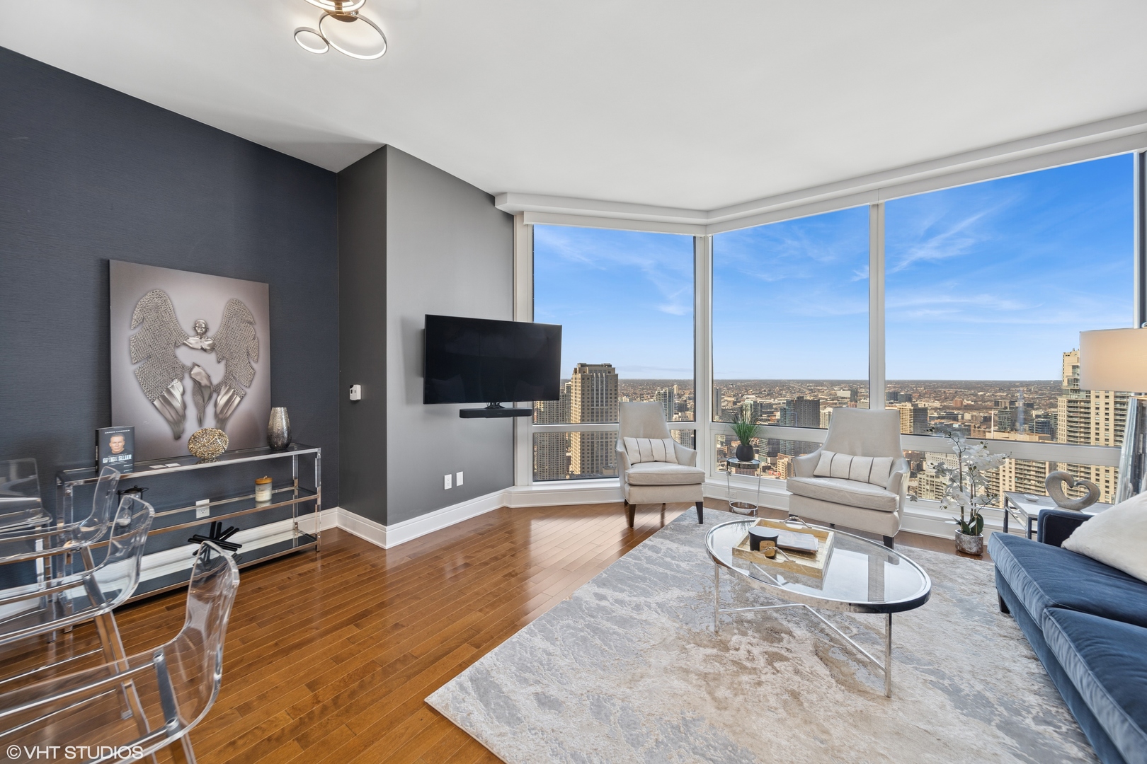 401 North Wabash Avenue, Unit 37D Chicago, IL 60611 - Photo 6 of 20 a living room with furniture and a flat screen tv