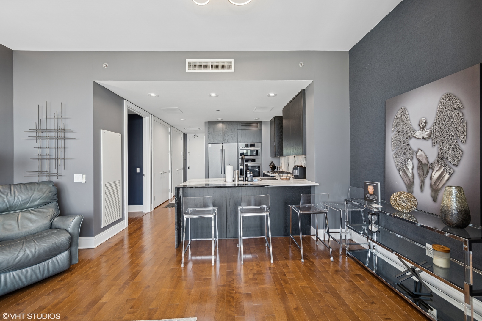 401 North Wabash Avenue, Unit 37D Chicago, IL 60611 - Photo 7 of 20 a view of a dining room with furniture and wooden floor