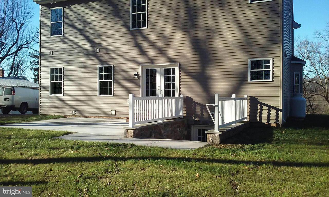 17523 Falls Road Upperco, MD 21155 - Photo 2 of 19 a front view of a house with a yard