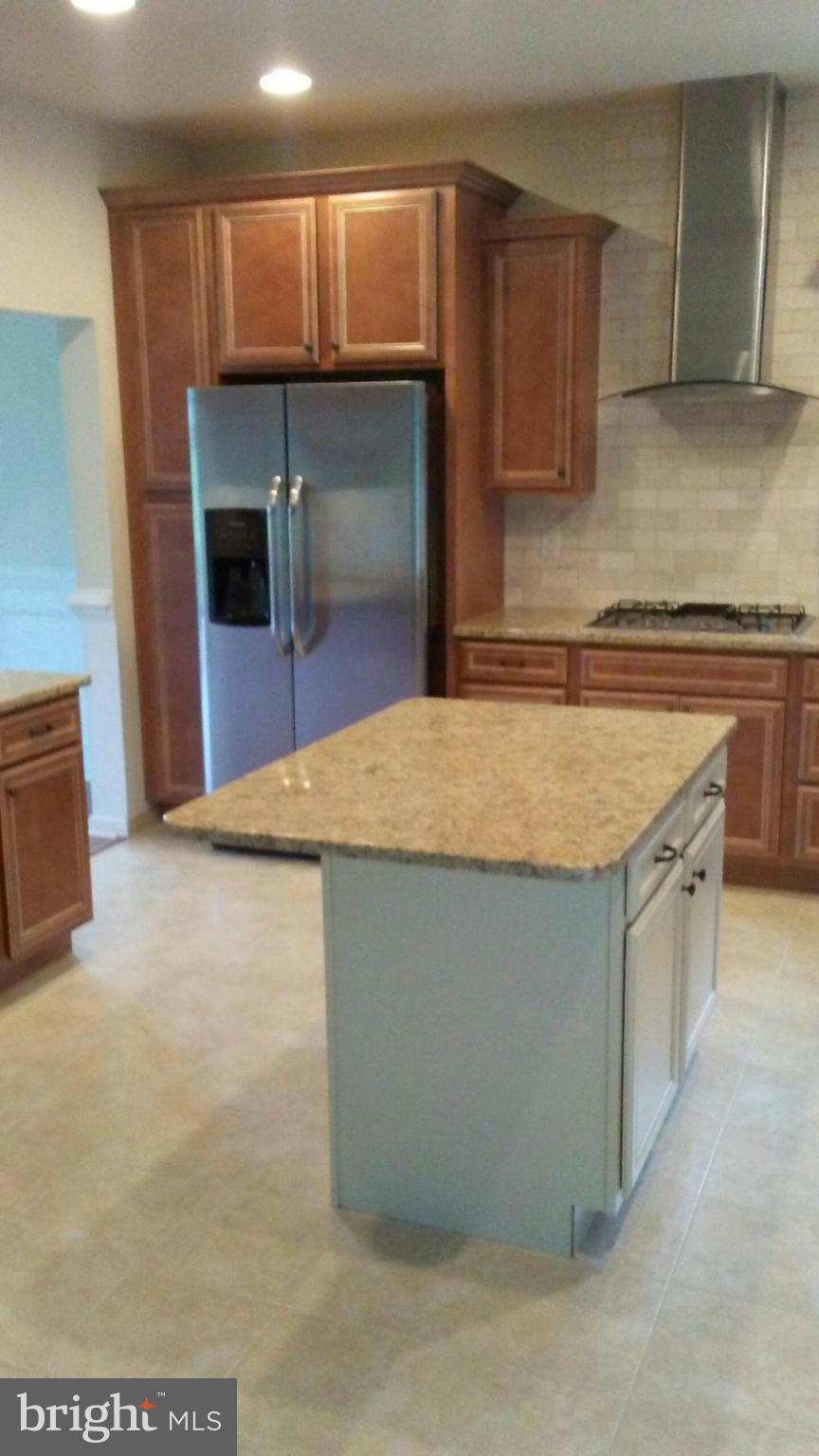 17523 Falls Road Upperco, MD 21155 - Photo 16 of 19 a kitchen with stainless steel appliances granite countertop a sink and a stove