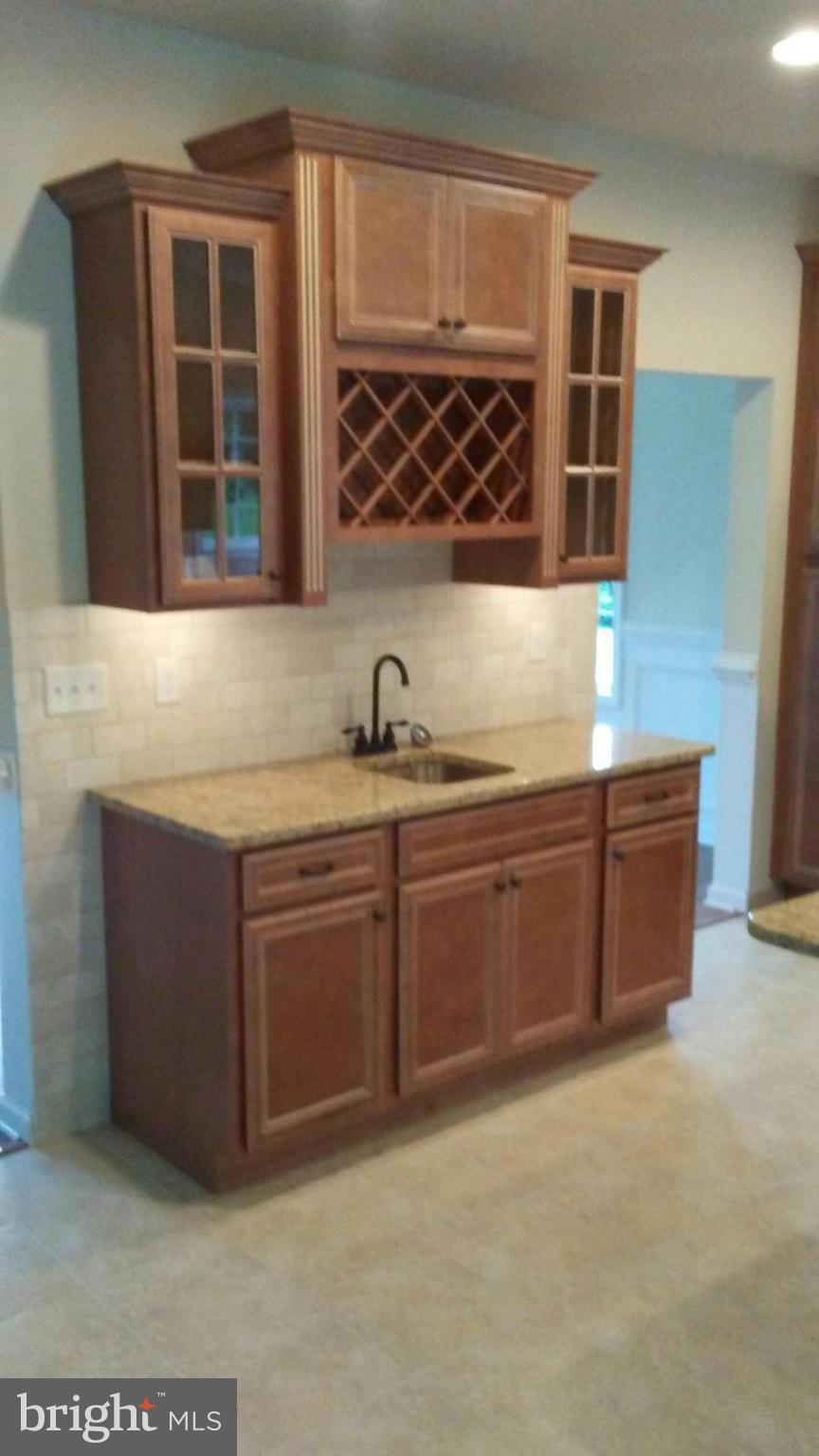 17523 Falls Road Upperco, MD 21155 - Photo 19 of 19 a kitchen with stainless steel appliances granite countertop a sink and a granite counter tops