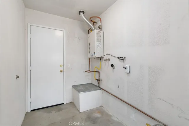 a bathroom with a granite countertop sink and shower