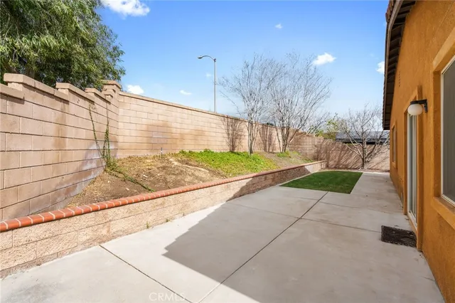 a view of a backyard of the house