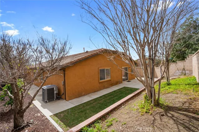 a view of a backyard with large trees