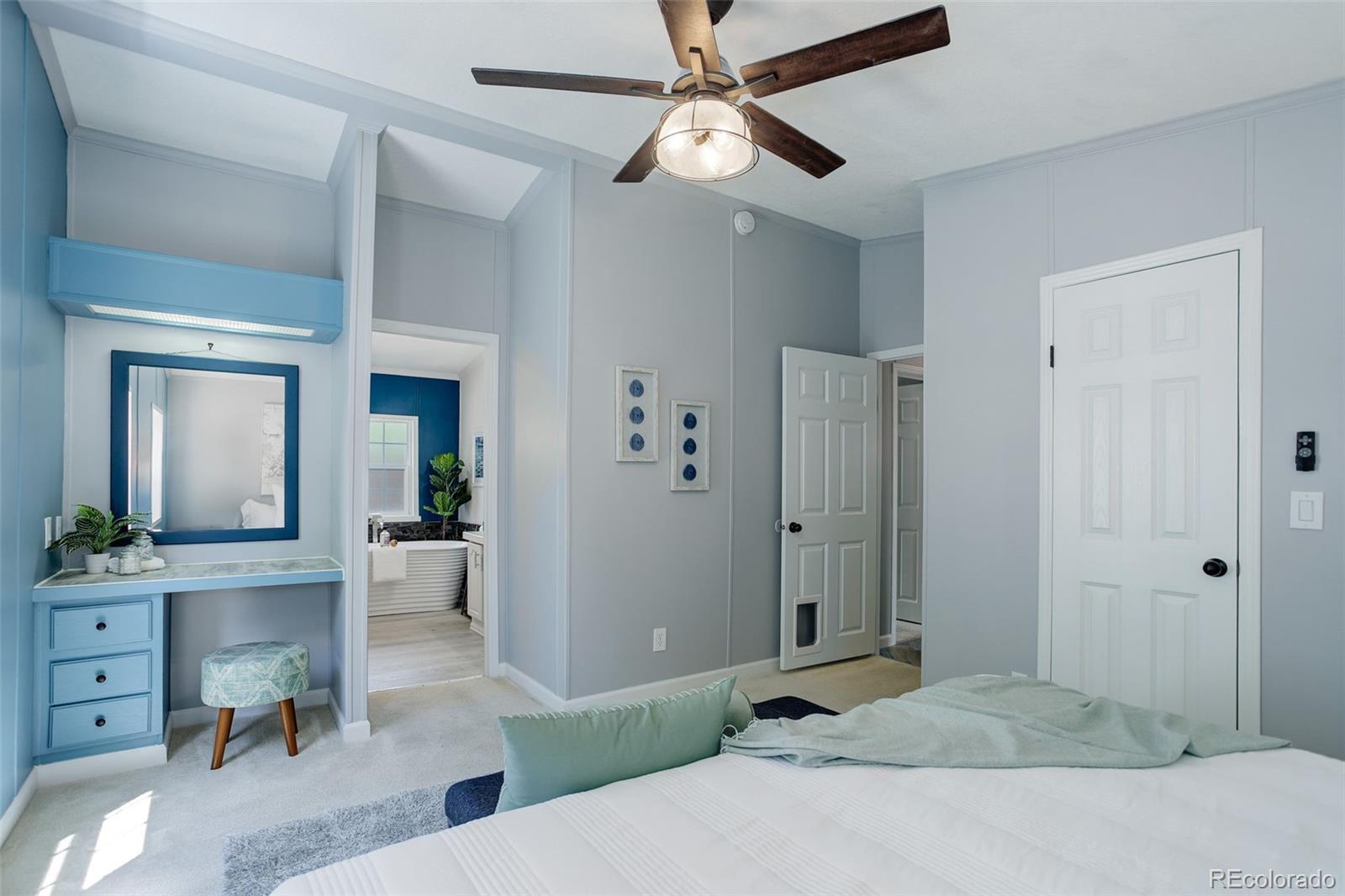 5115 West Custer Place Denver, CO 80219 - Photo 14 of 25 a bedroom with a bed and a chandelier