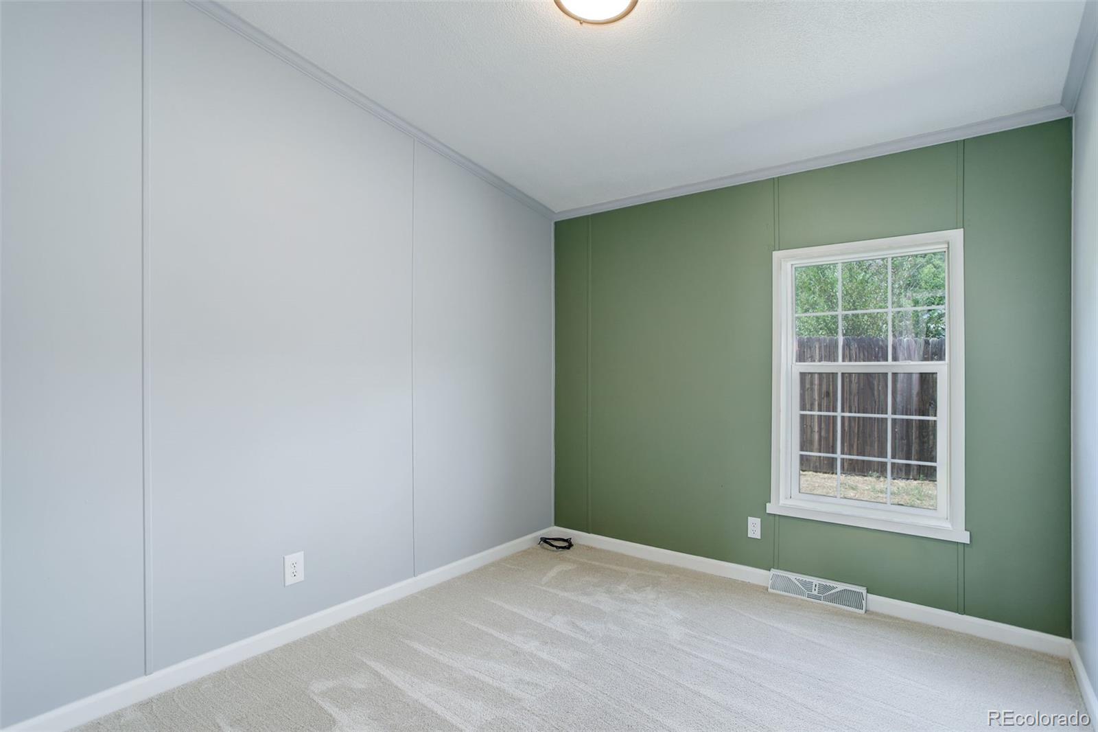 5115 West Custer Place Denver, CO 80219 - Photo 20 of 25 an empty room with windows