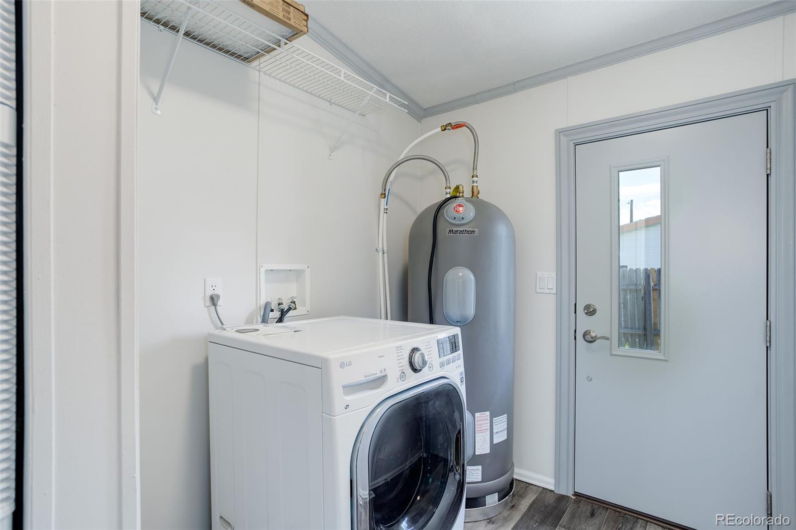 5115 West Custer Place Denver, CO 80219 - Photo 21 of 25 a utility room with dryer and washer