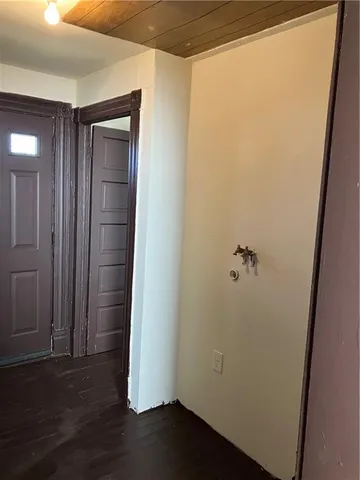 an empty room with wooden floor