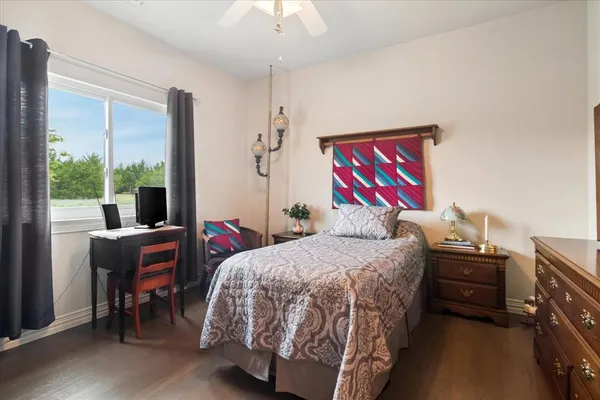 a bedroom with a bed and a desk