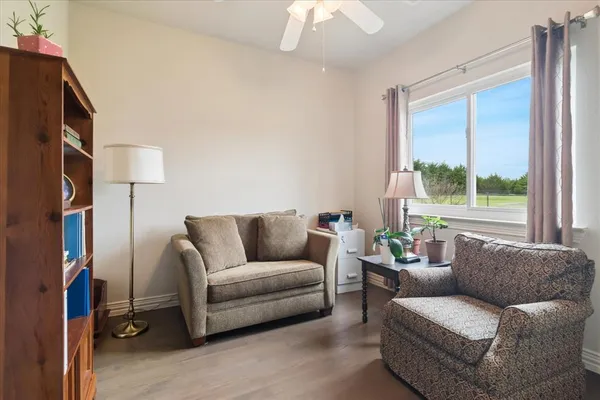 a living room with furniture and a window