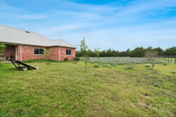 a view of a house with a big yard