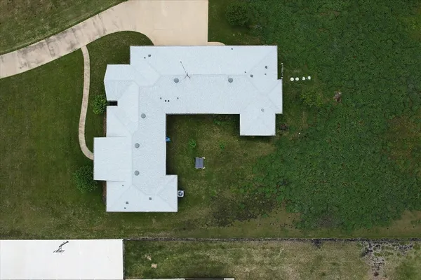 an aerial view of residential house with outdoor space
