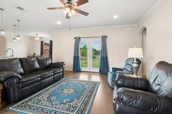 a living room with furniture and a rug