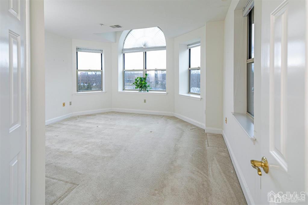 2423 Windrow Drive Plainsboro, NJ 08540 - Photo 15 of 36 an empty room with windows