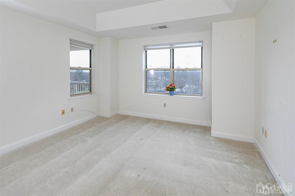 2423 Windrow Drive Plainsboro, NJ 08540 - Photo 20 of 36 an empty room with windows
