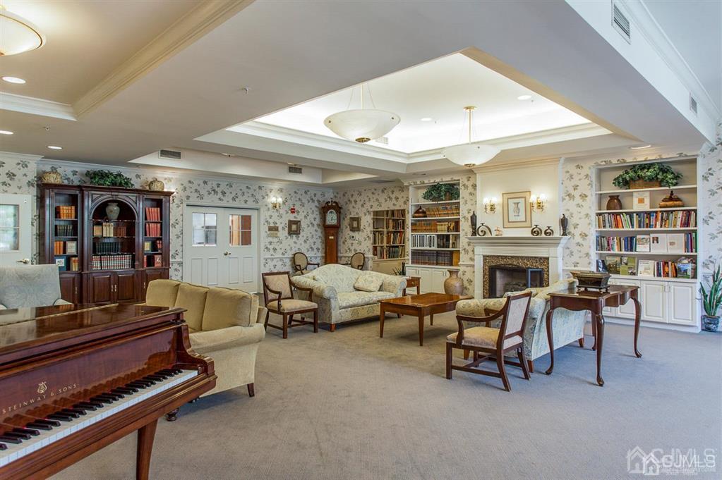 2423 Windrow Drive Plainsboro, NJ 08540 - Photo 27 of 36 a living room with furniture fireplace and rug