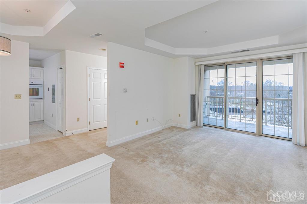 2423 Windrow Drive Plainsboro, NJ 08540 - Photo 6 of 36 a view of an empty room with a window