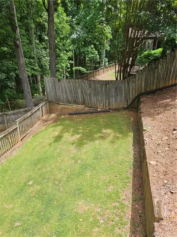 a swimming pool with wooden fence