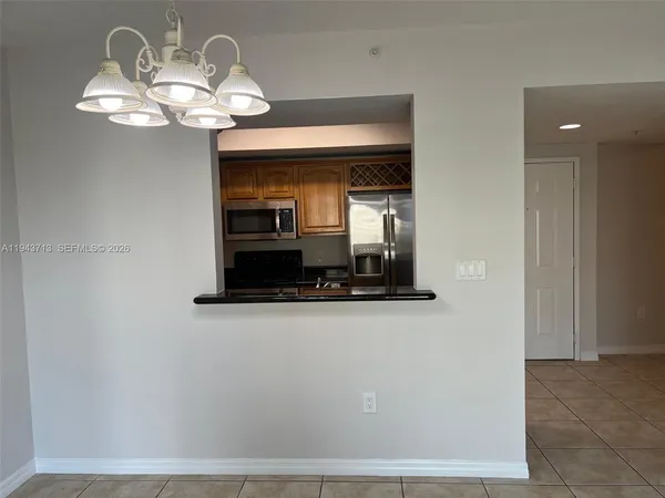a view of a hallway with chandelier
