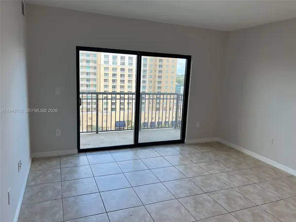 a view of a room has a large window