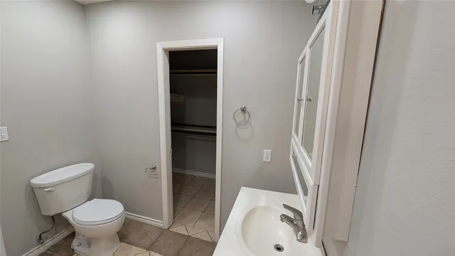 a bathroom with a sink and toilet