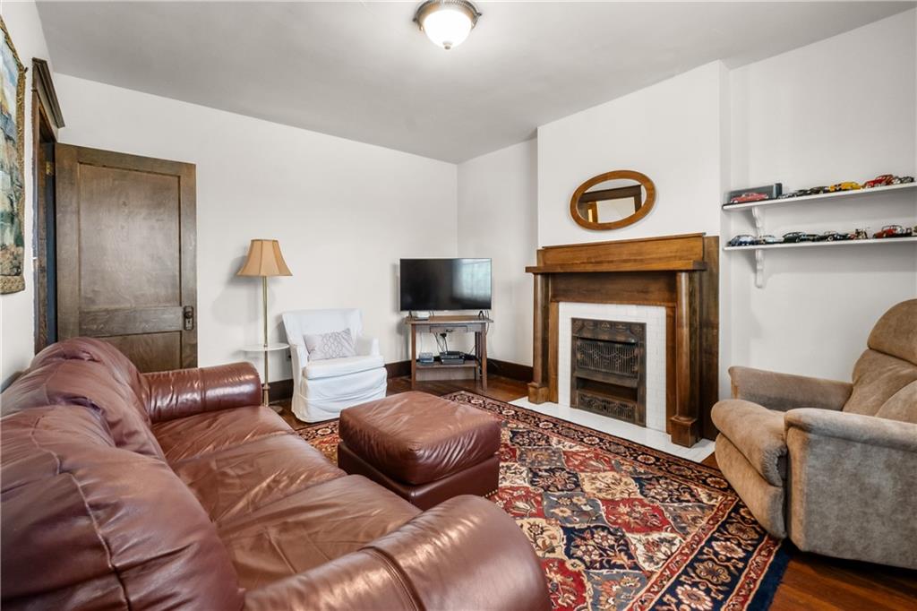 47 Ralston Place Mt. Lebanon, PA 15216 - Photo 30 of 44 Comfortable living space with fireplace—ideal for relaxing