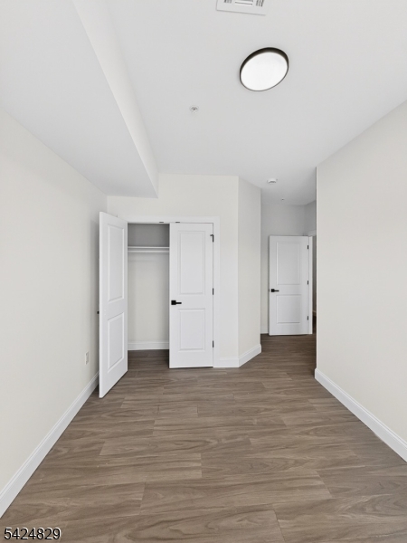 262 Hunterdon Street, Unit 1 Newark, NJ 07103 - Photo 13 of 31 a view of an empty room with wooden floor