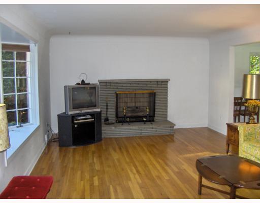 3612 Wayne Road Munhall, PA 15120 - Photo 3 of 18 Living Room. Stone fireplace in the spacious 21 x13 living room. Beautiful hardwood floors throughout.