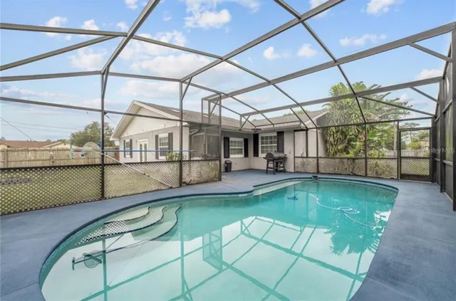 a view of a swimming pool with a porch