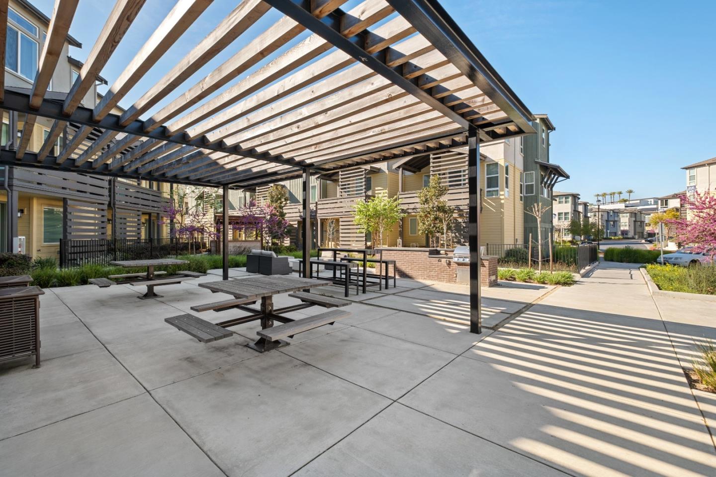 511 Sage Court Milpitas, CA 95035 - Photo 12 of 47 a view of a patio with a table and chairs under an umbrella