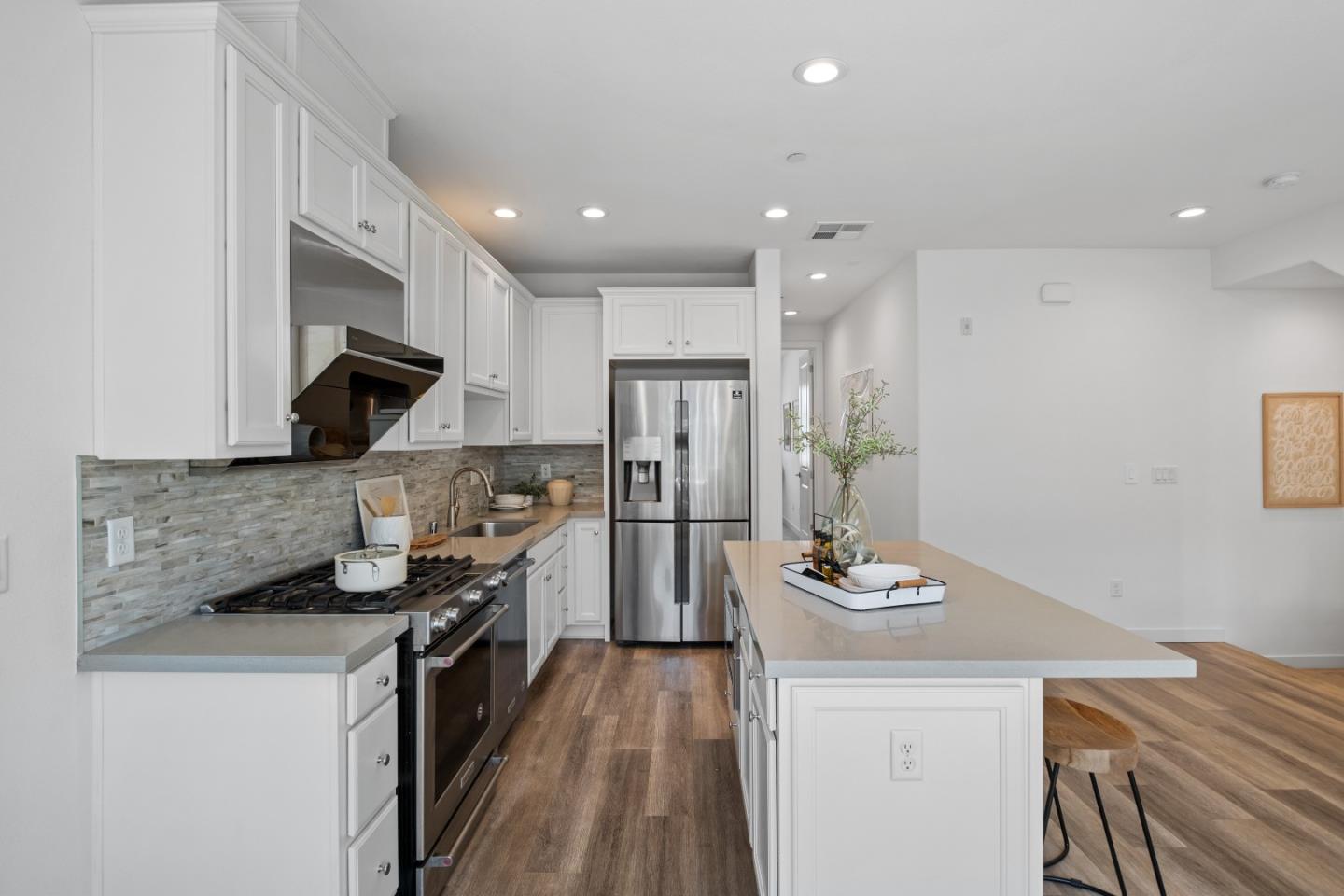 511 Sage Court Milpitas, CA 95035 - Photo 18 of 47 a kitchen with stainless steel appliances granite countertop a sink stove and refrigerator