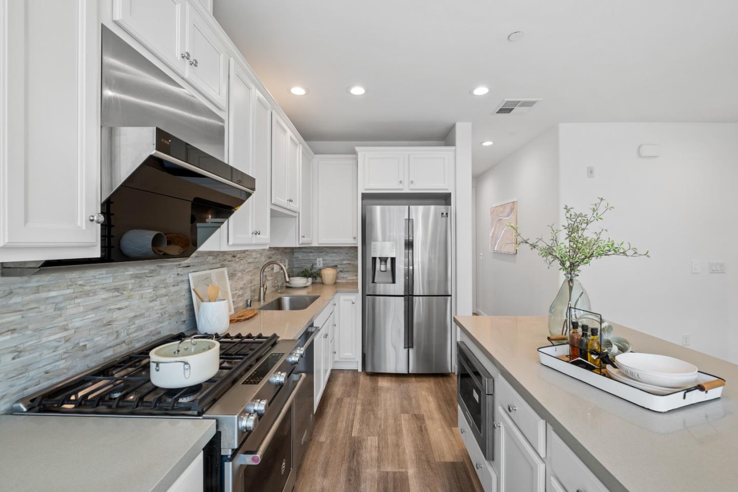 511 Sage Court Milpitas, CA 95035 - Photo 21 of 47 a kitchen with sink refrigerator and stove
