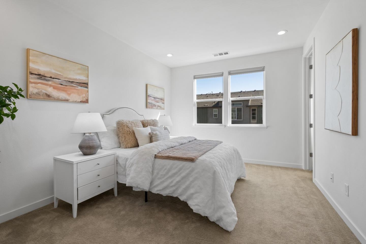 511 Sage Court Milpitas, CA 95035 - Photo 23 of 47 a spacious bedroom with two beds and a window