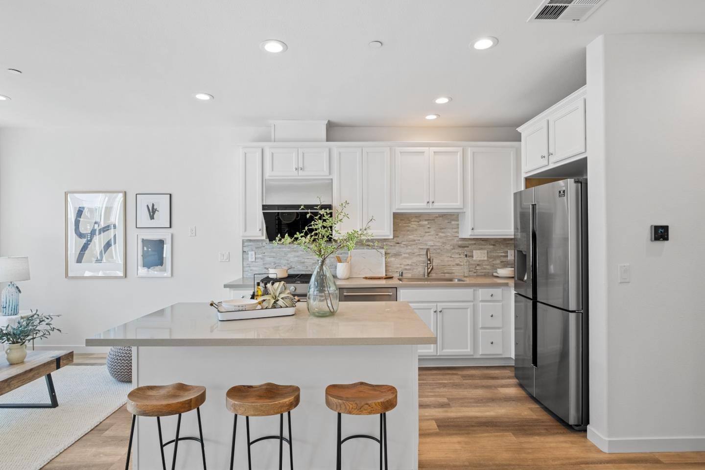 511 Sage Court Milpitas, CA 95035 - Photo 7 of 47 a kitchen with stainless steel appliances granite countertop a dining table chairs refrigerator and sink