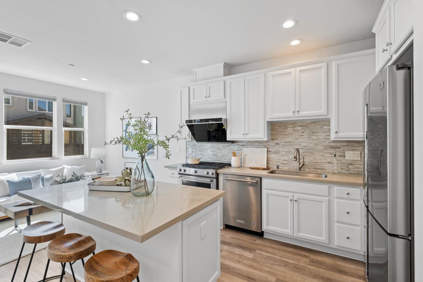 511 Sage Court Milpitas, CA 95035 - Photo 8 of 47 a kitchen with granite countertop a sink stove and cabinets