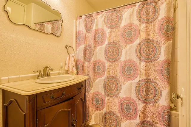 a bathroom with a sink and a mirror