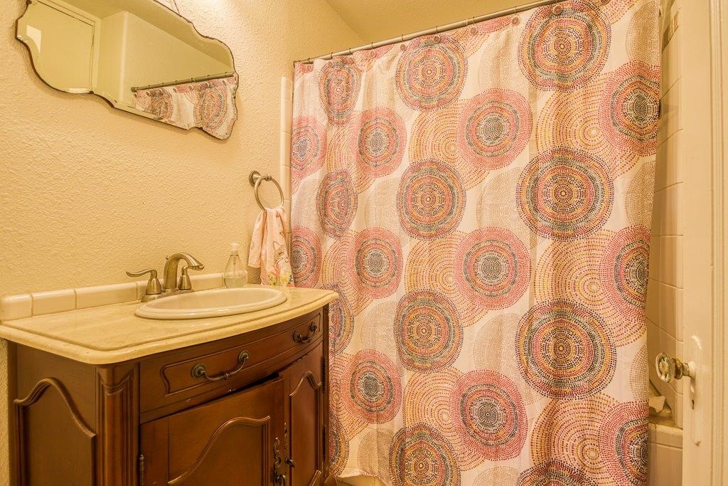 322 Fetick Avenue Taft, TX 78390 - Photo 15 of 34 a bathroom with a sink and a mirror