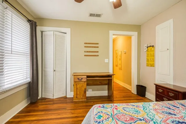 a bedroom with a bed and a dresser