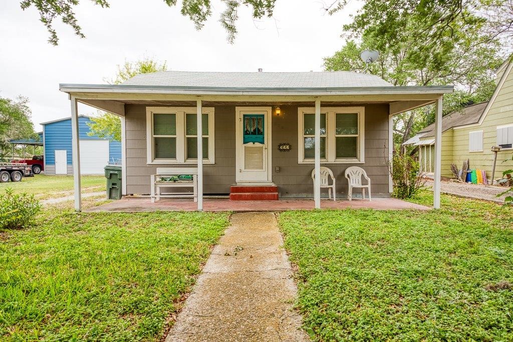 322 Fetick Avenue Taft, TX 78390 - Photo 2 of 34 a front view of a house with garden