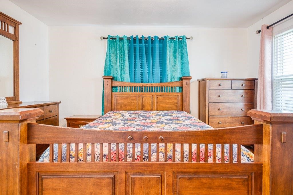 322 Fetick Avenue Taft, TX 78390 - Photo 26 of 34 a bedroom with a bed and a window