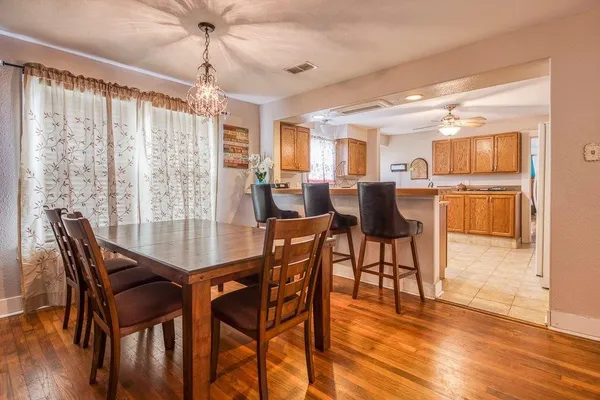 a dining room with furniture and window