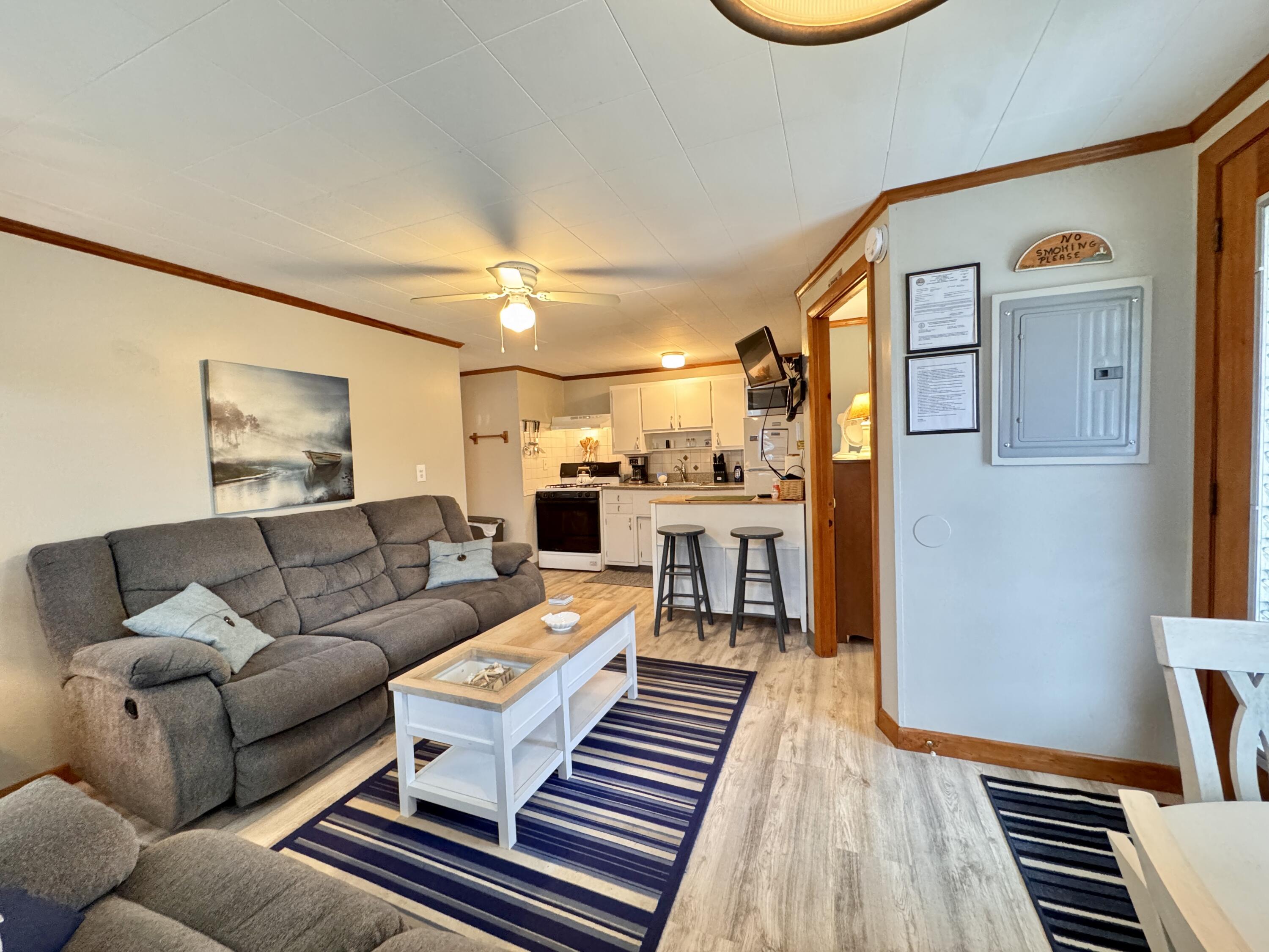 56-58 Uncle Rolf Road Dennis Port, MA 02639 - Photo 13 of 44 a living room with furniture and a rug