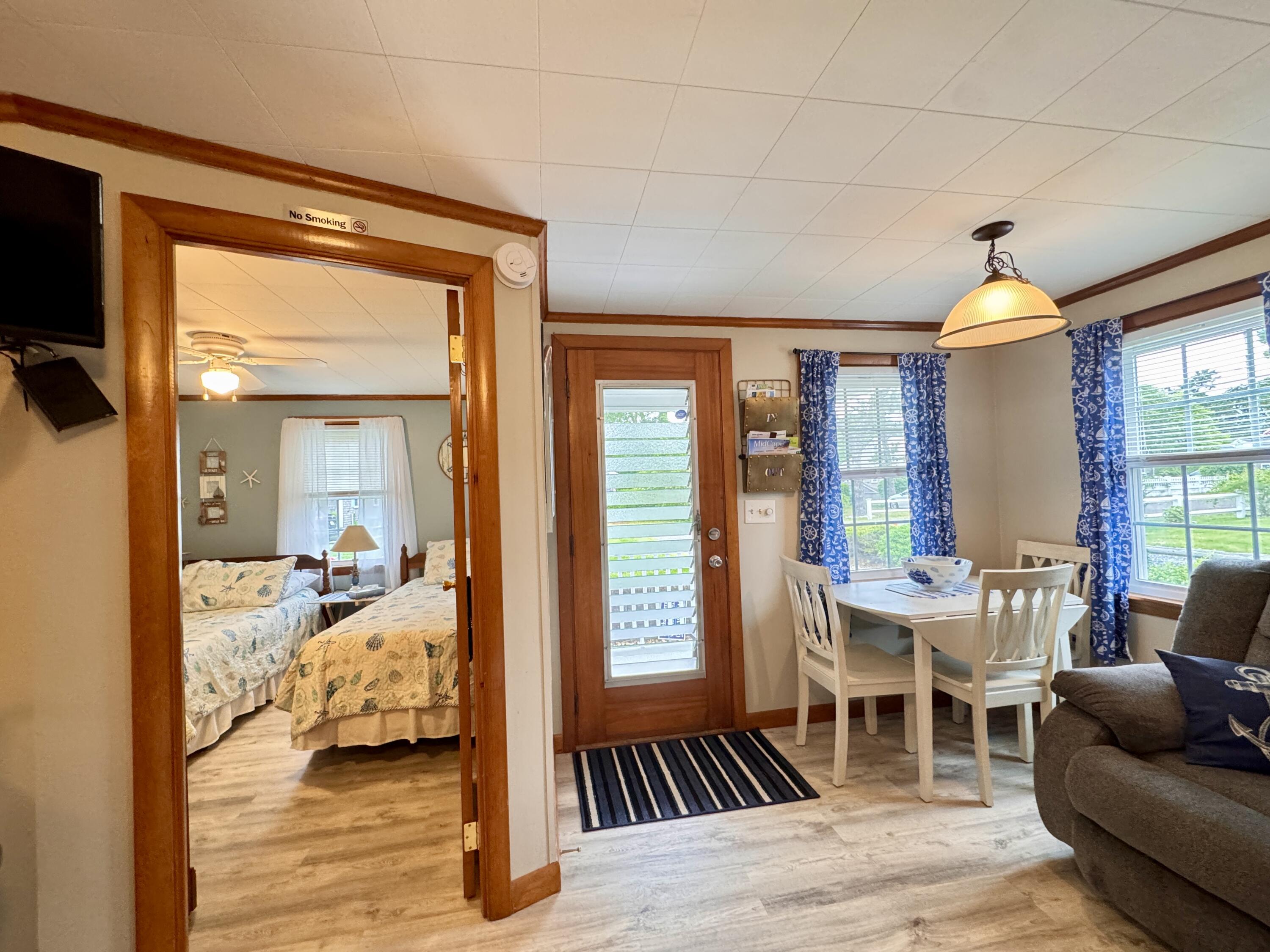 56-58 Uncle Rolf Road Dennis Port, MA 02639 - Photo 17 of 44 a view of a livingroom with furniture and windows