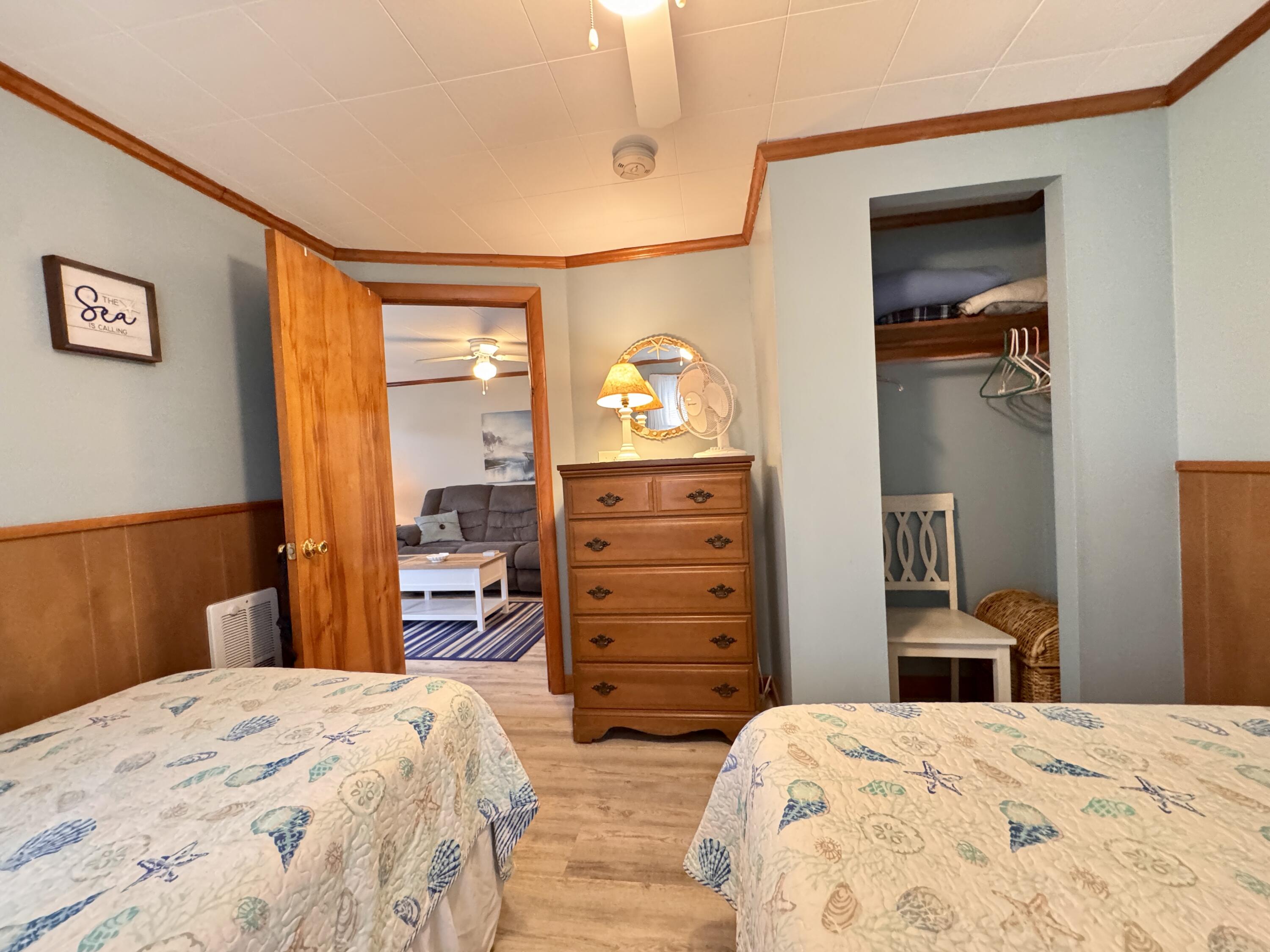 56-58 Uncle Rolf Road Dennis Port, MA 02639 - Photo 20 of 44 a bedroom with a bed and a dresser