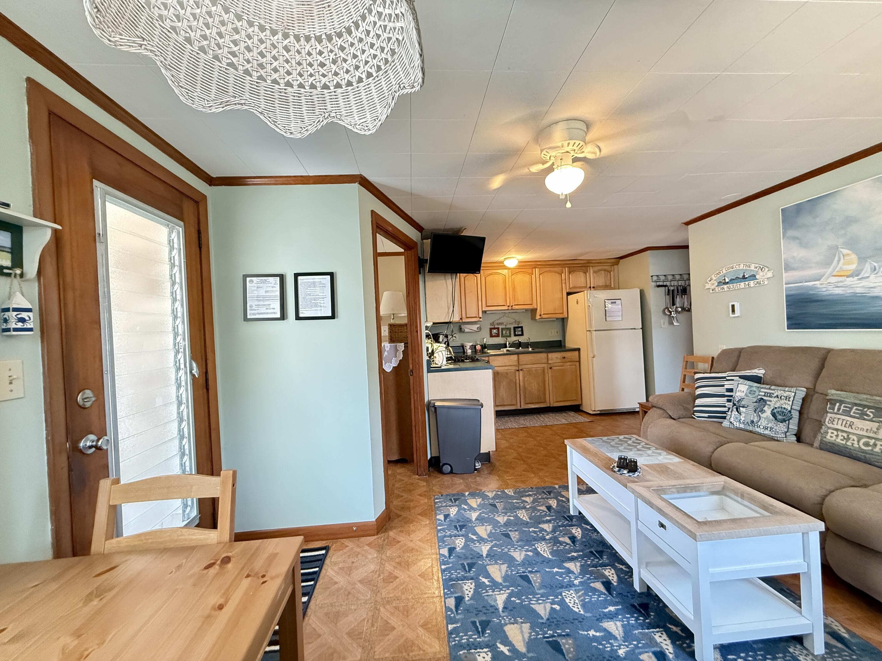 56-58 Uncle Rolf Road Dennis Port, MA 02639 - Photo 24 of 44 a living room with furniture and a rug