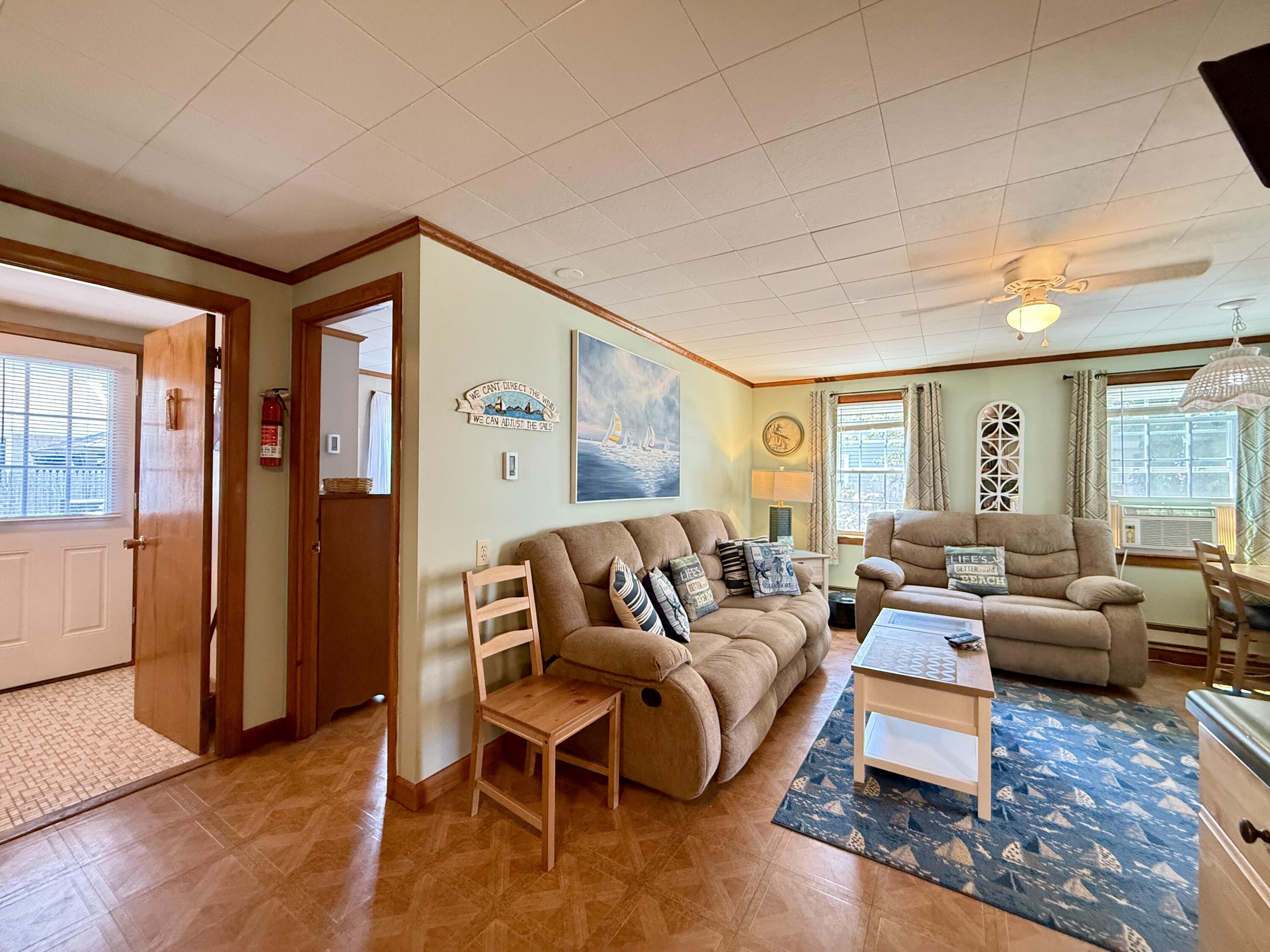56-58 Uncle Rolf Road Dennis Port, MA 02639 - Photo 27 of 44 a living room with furniture and wooden floor