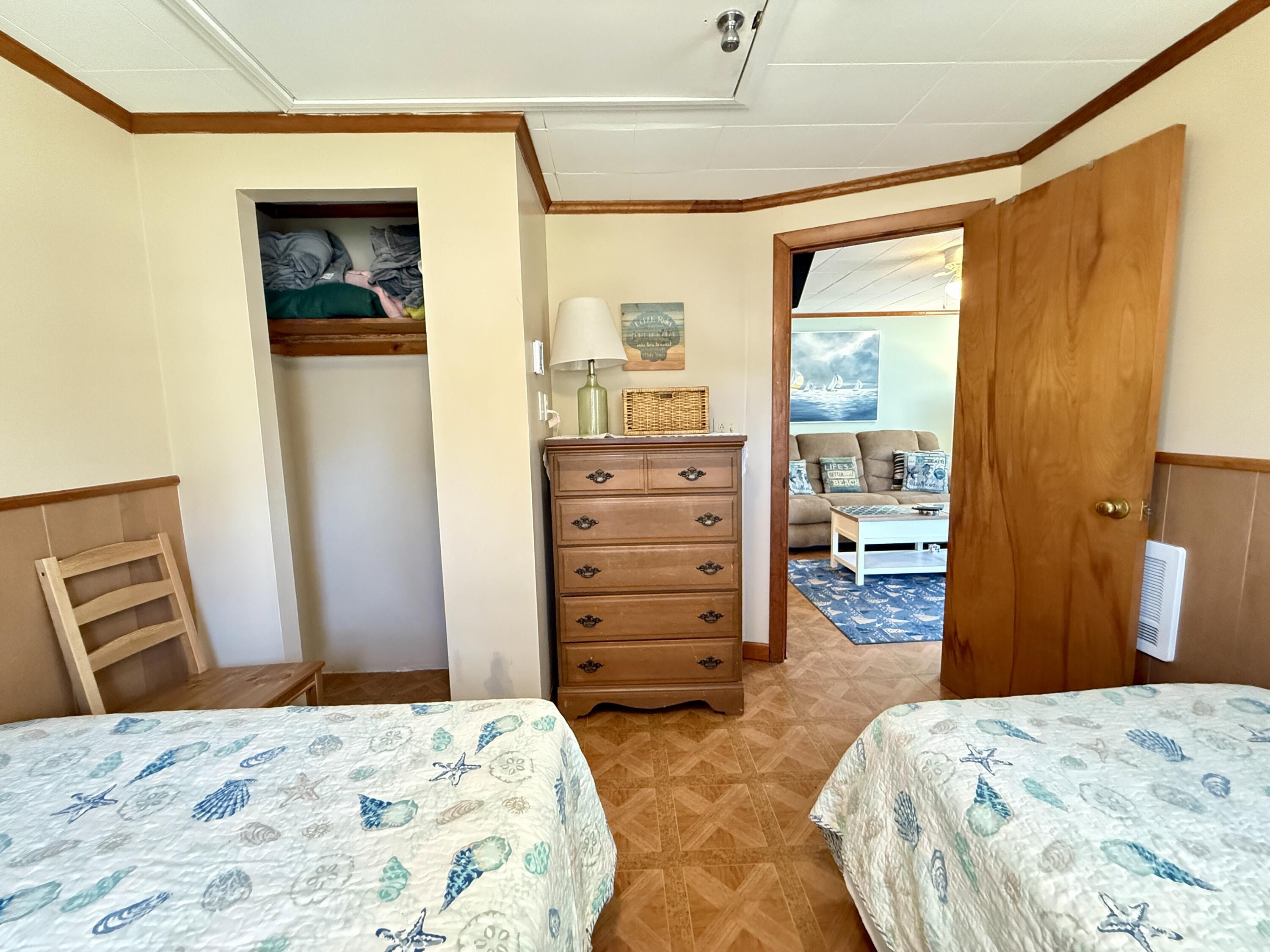 56-58 Uncle Rolf Road Dennis Port, MA 02639 - Photo 31 of 44 a bedroom with a bed and a dresser