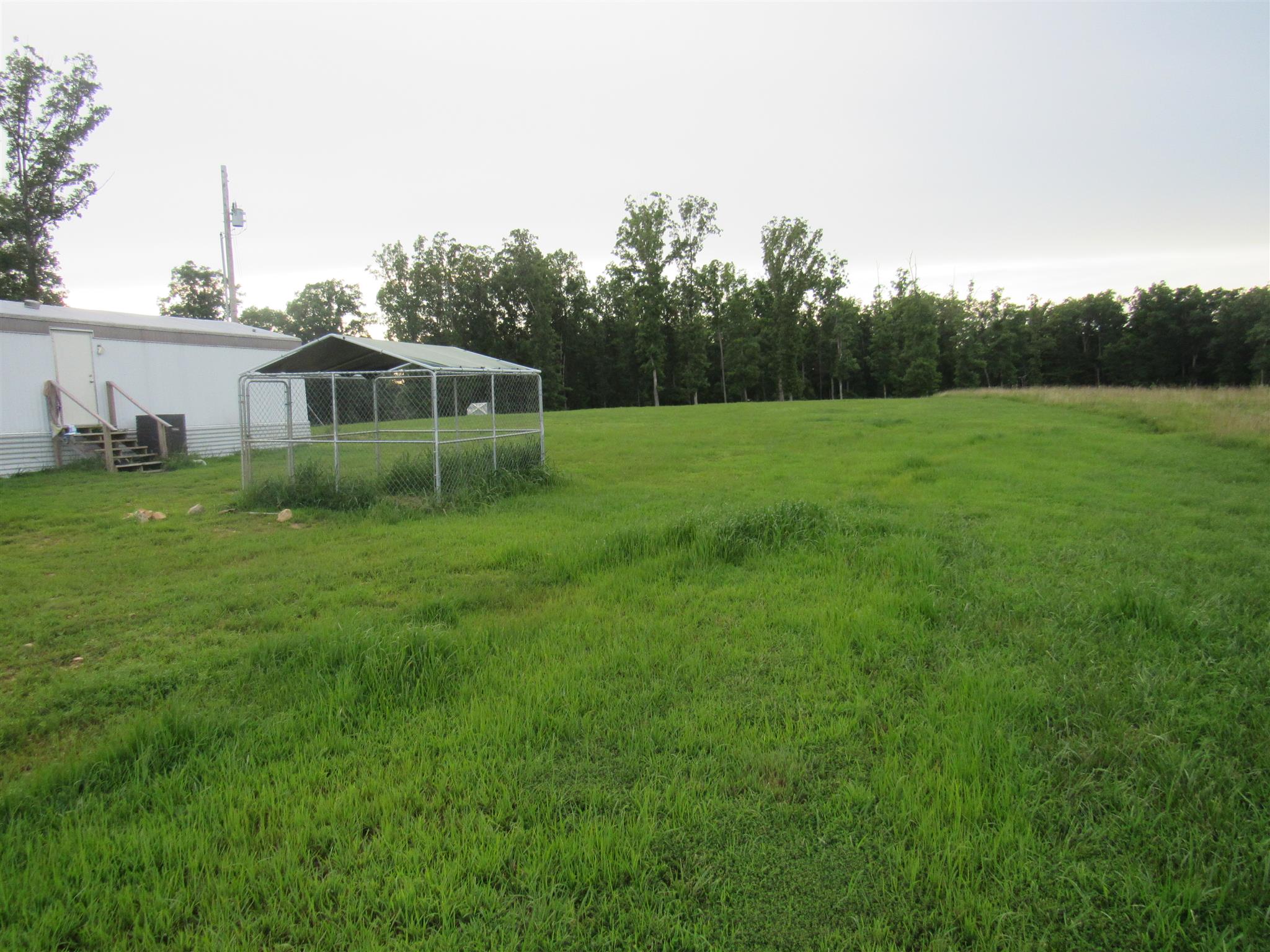 2050 CCC Road McEwen, TN 37101 - Photo 14 of 16 a view of a house with a big yard
