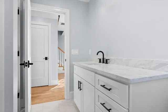a bathroom with a sink and a mirror