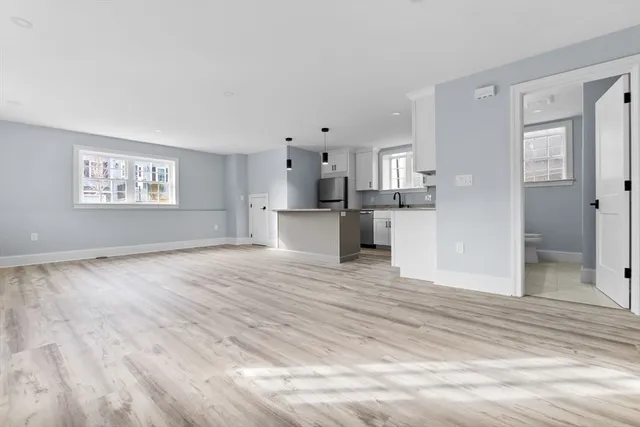 a view of a kitchen cabinets and wooden floor